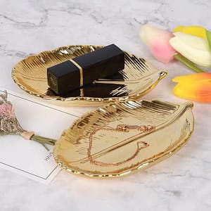 gold leaf ceramic plate jewelry dish trinket tray lifestyle shot with bracelet and lipstick