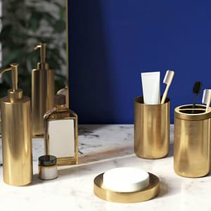 Stainless Steel Bathroom Supplies Lotion Bottle Toothbrush Cup Toothbrush Holder Soap Dish Four piece Set Bathroom lifestyle shot with soap