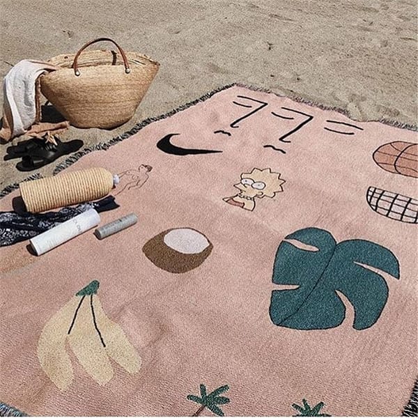 pink hawaii throw blanket sofa cover lifestyle shot on the beach