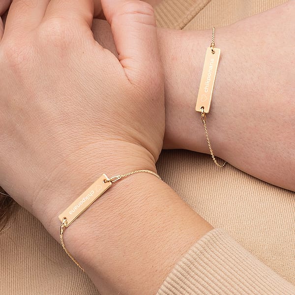 love chikponana gold bracelet on wrist two girls