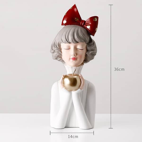 Girl in White sweater with golden apple home decor display statue
