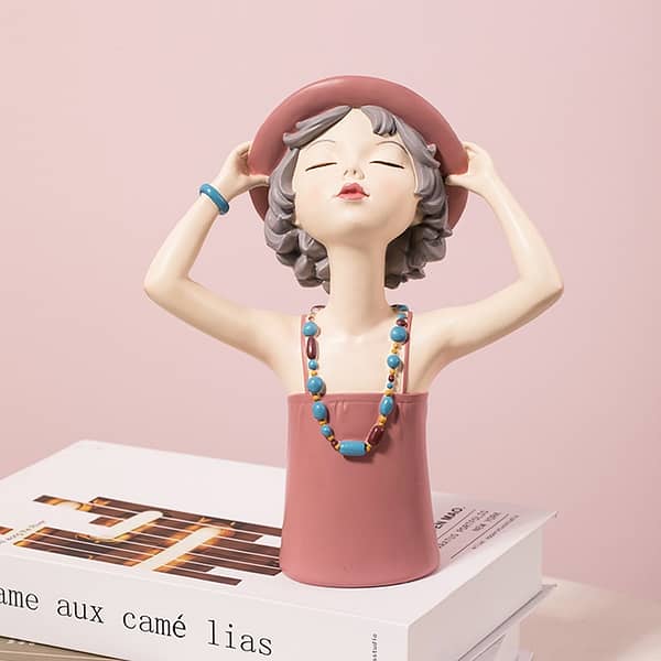 summer girls home display decoration girl with pink hat and colored necklace looking up to the sun lifestyle shot